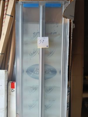 a glass door that is in the middle of a pile of boxes