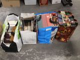 many bags of books on the floor next to each other