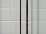 a close up view of a pair of golf clubs on a stand