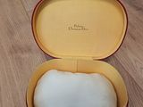 a box with a white soap inside of it on a wooden floor