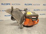 a chainsaw is sitting on a table in front of a sign