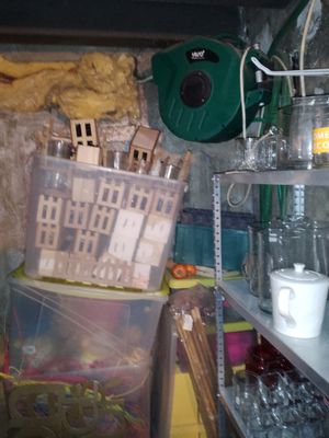 a room with a lot of clutter and items on the shelves