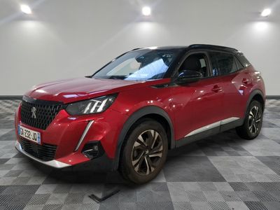 a red suv parked in a room with a checkered floor