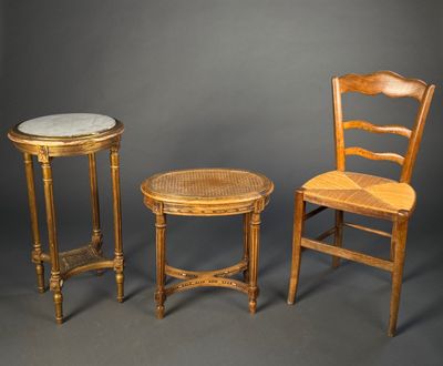 two chairs and a table are shown against a gray background