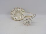 an image of a cup and saucer sitting on a white surface