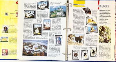 un livre ouvert sur lequel figurent des images d'animaux