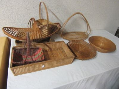 many baskets on a table with a white table cloth