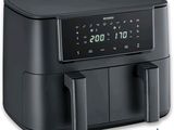 an image of a black air fryer sitting on top of a counter