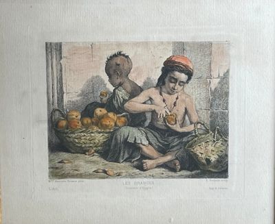une photo d'un homme et d'une femme assis devant une corbeille de fruits