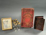 several items including a book, a wine glass, and a picture of a woman