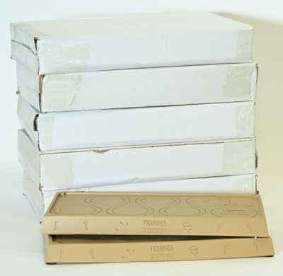 boxes of pizza stacked on top of each other on a white surface