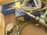 a box with a bunch of hoses and other tools on it