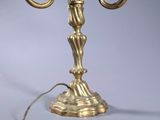 a lamp that has a bird on top of it