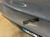 a close up of a car ' s bumper with a sticker on it