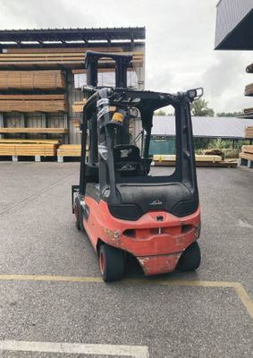 a forklift truck that is parked in a parking lot