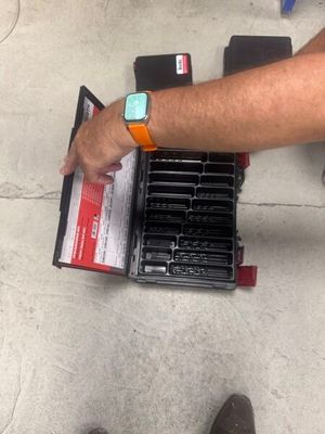 a man that is standing next to a box of batteries