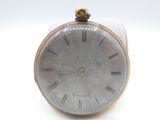 clock with roman numerals on the face on a white surface