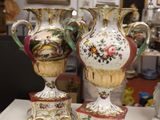 three vases sitting on a table in a room