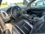 the interior of a car with black leather seats and a steering wheel