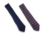 two ties on a white surface one is blue and the other is red