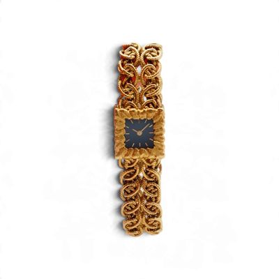 une photo d'une montre-bracelet en or avec un cadran noir