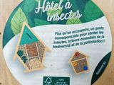a sticker with a picture of a bird house and a bird feeder