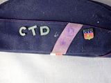 a close up of a blue case with a name on it