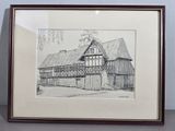 drawing of an old barn in a frame on a table