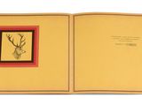 an open book with a picture of a deer on it