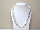 pearl necklace with a silver clasp on a white mannequin