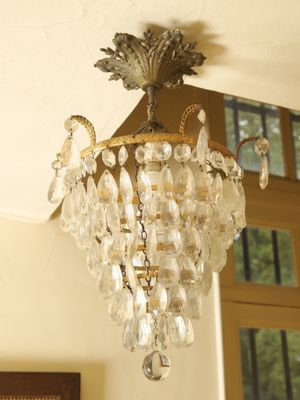 a chandelier hanging from the ceiling in a room