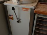 a kitchen with a sink and a stove in it