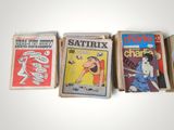 several comics are stacked on top of each other on a table