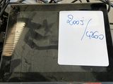 a black box with a sign on it sitting on a table