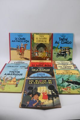 several children ' s books are lined up on a white surface