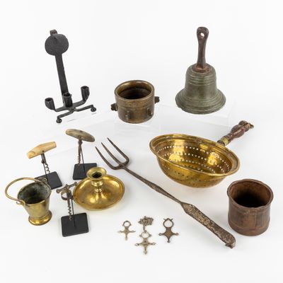 an image of a collection of brass objects on a white surface