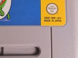 a nintendo super mario world game on the back of a nintendo game console
