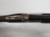 an image of a close up of a gun on a white surface