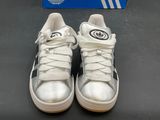 adidas superstar shoes with white laces and a blue box