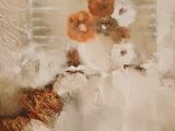 un tableau représentant un chien avec une fleur dans la gueule