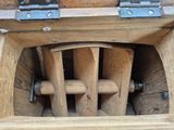 a wooden box that has a bunch of wooden items inside of it