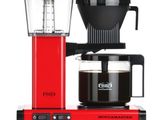 a close up of a red coffee maker on a white background