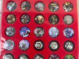 a picture of a red tray filled with lots of magnets