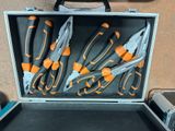 many tools in a case that are sitting on the floor
