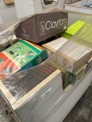 a box full of books sitting on top of a table
