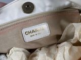 someone is holding a white purse with a white label on it