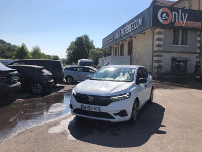 a white car that is parked in front of a building