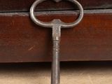 an old key that is sitting on the floor