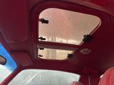 a view of the inside of a car with the sun shining through the window