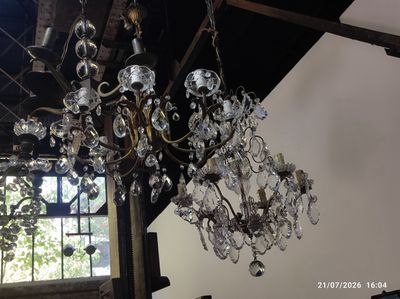 a chandelier hanging from the ceiling in a room